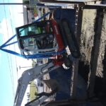 Lowering a Mini Excavator into an Excavation